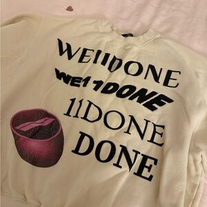 Cream Sweatshirt with Black and Pink Graphics